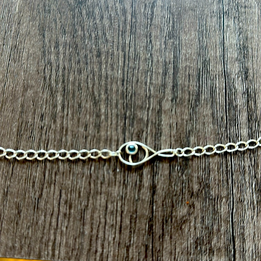 sterling silver and sapphire bracelet with tennis racquet and ball